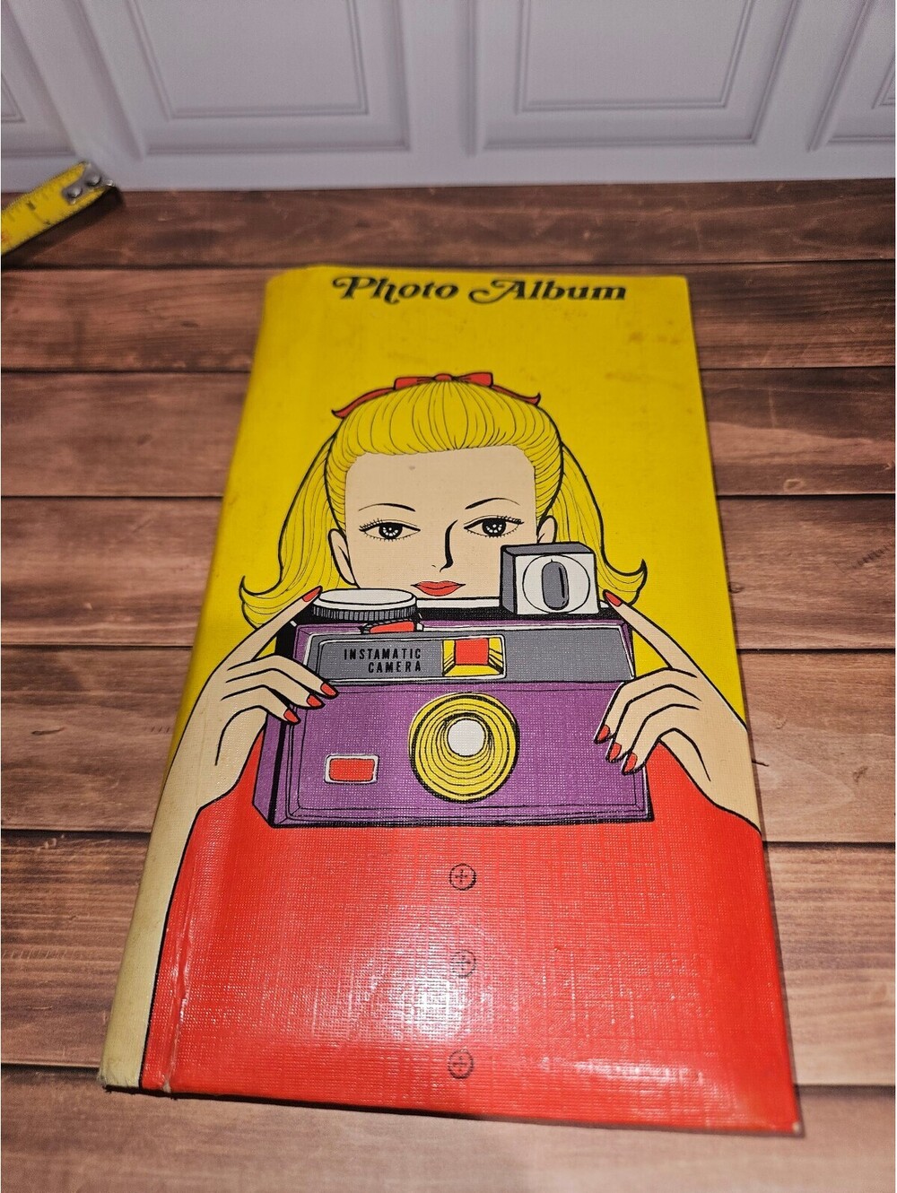 Vintage Photo Album with Retro Camera Illustration Cover